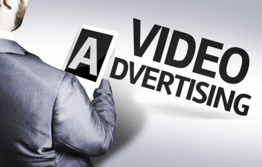 Business man with the text Video Advertising in a concept image clipart