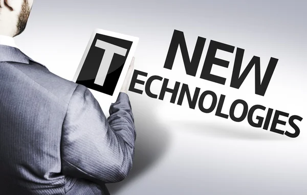 Uomo d'affari con il testo Nuove tecnologie in un'immagine concettuale — Foto Stock
