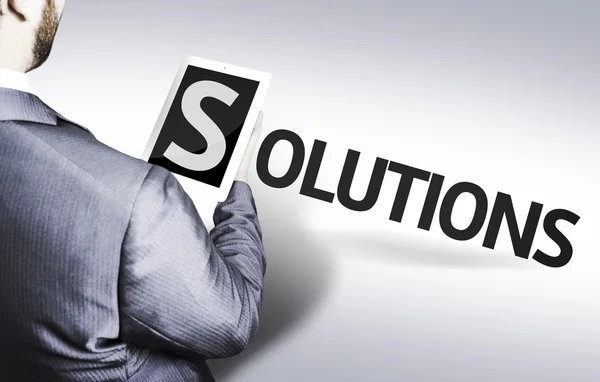 Business man with the text Solutions in a concept image — Stock Photo, Image