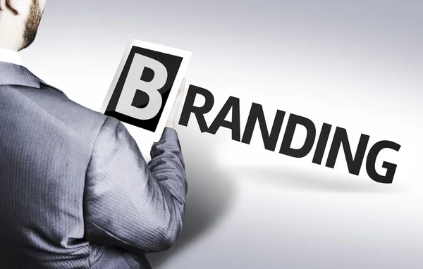 Affärsman med text branding i en koncept-bild — Stockfoto
