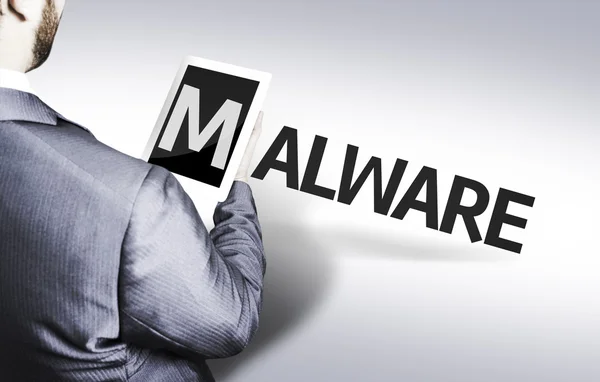 Homme d'affaires avec le texte Malware dans une image de concept — Photo