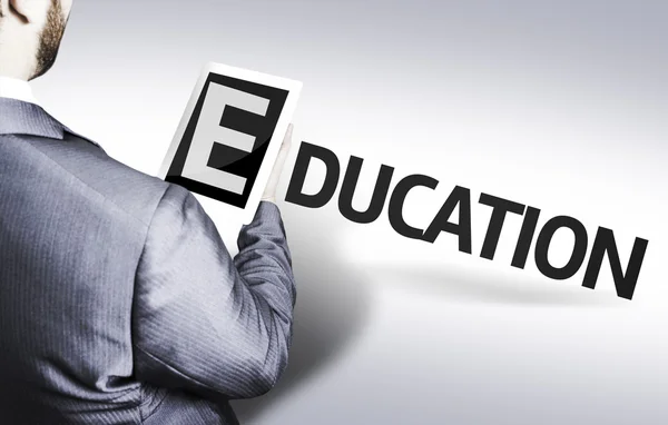 Hombre de negocios con el texto Educación en una imagen conceptual — Foto de Stock