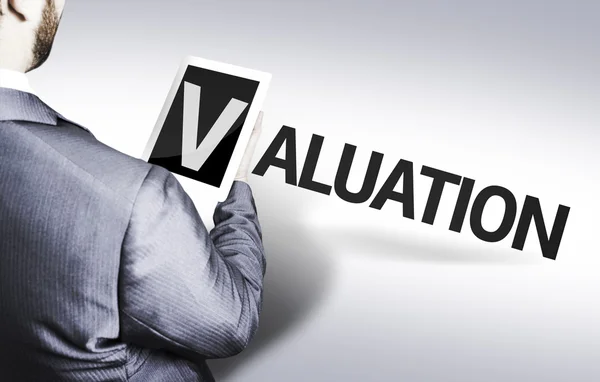 Business man with the text Valuation in a concept image — Stock Photo, Image