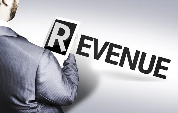 Business man with the text Revenue in a concept image — Stock Photo, Image