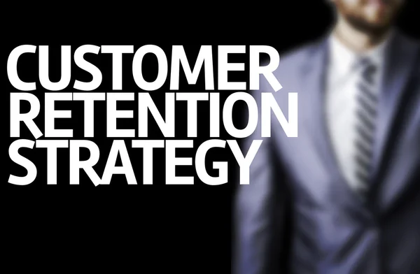 Customer Retention Strategy written on a board with a business man — Stock Photo, Image