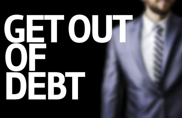 Ger Out Of Debt escrito em um conselho com um homem de negócios — Fotografia de Stock