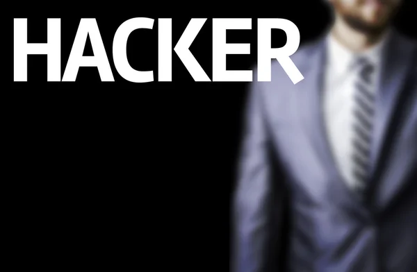 Hacker written on a board with a business man — Stock Photo, Image