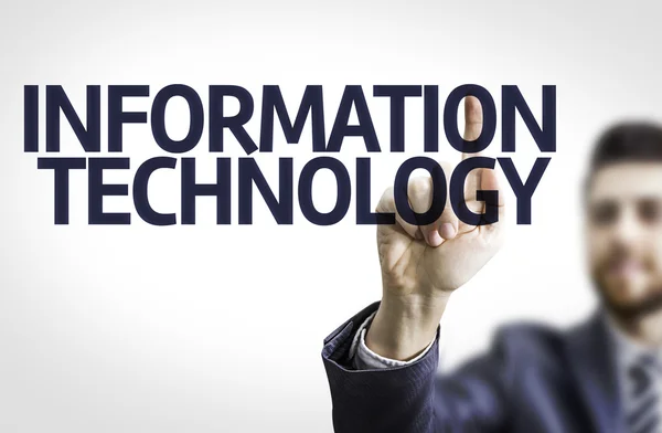 Homme d'affaires pointant vers un tableau transparent avec le texte : Technologies de l'information — Photo