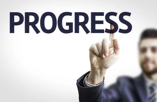 Business man pointing to board with text: Progress — Stock Photo, Image