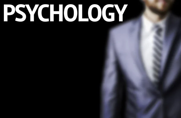 Psychology written on a board with a business man — Stock Photo, Image