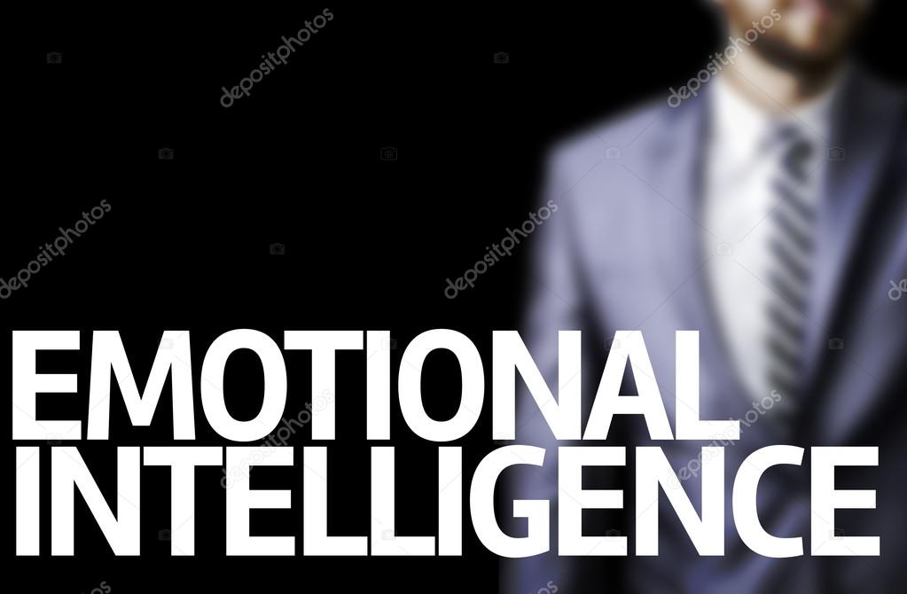 Emotional Intelligence written on a board with a business man