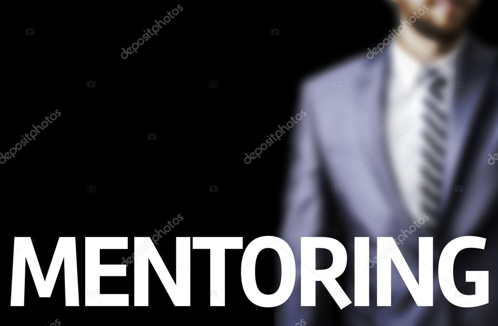 Mentoring written on a board with a business man