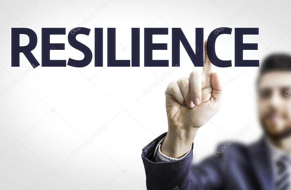 Business man pointing to board with text: Resilience