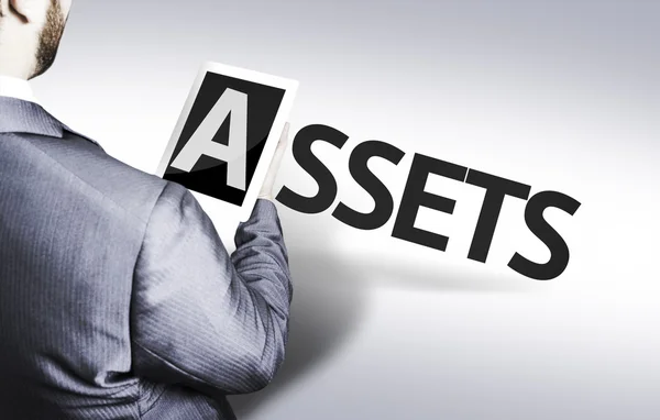 Businessman with the text Assets — Stock Photo, Image