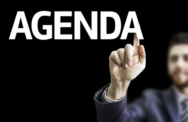 Podnikatel s textem: Agenda — Stock fotografie