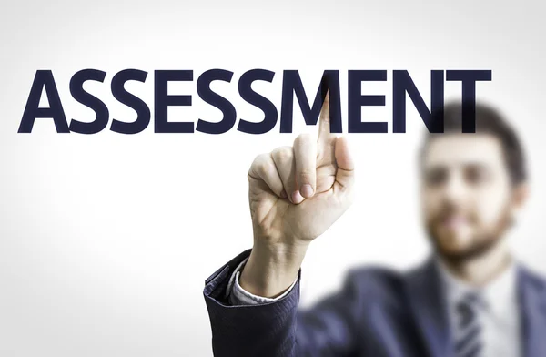 Businessman with text: Assessment — Stock Photo, Image