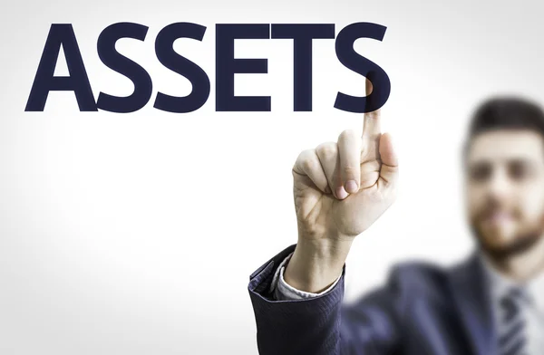 Businessman with text: Assets — Stock Photo, Image