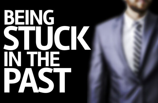 Being Stuck In the Past written on a board