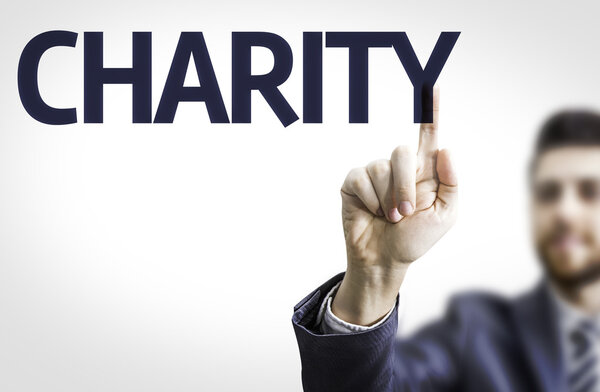 Business man pointing the text: Charity