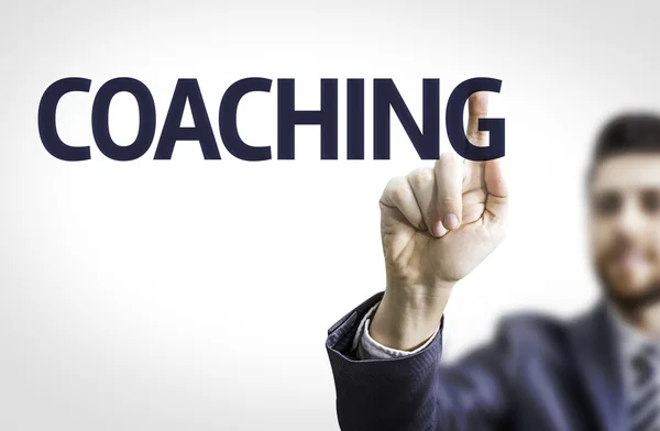 Geschäftsmann zeigt den Text: Coaching — Stockfoto