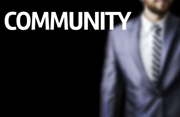 Gemeenschap geschreven op een bord met een zakenman — Stockfoto