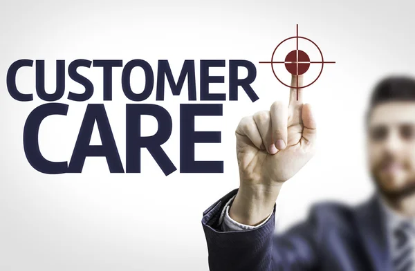 Zakenman wijzen de tekst: Customer Care — Stockfoto