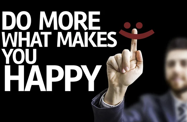 Homme d'affaires pointant le texte : Faites plus de ce qui vous rend heureux — Photo