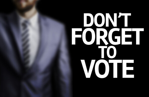 Don 't Forget to Vote written on a board
