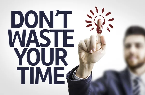 Business man pointing the text: Don 't Waste Your Time — стоковое фото