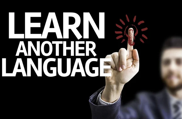 Business man pointing the text: Learn Another Language — Stock Photo, Image