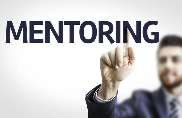 Business man pointing the text: Mentoring — Stock Photo, Image