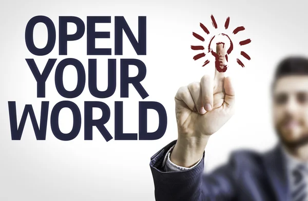 Бизнесмен указывает на текст: "Открой свой мир" — стоковое фото
