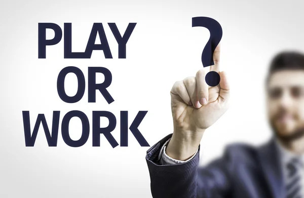 Business man pointing the text: Play or Work? — Stock Photo, Image