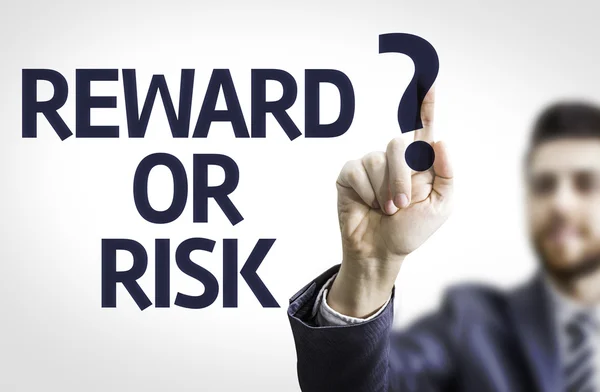 Business man pointing the text: Reward or Risk? — Stock Photo, Image