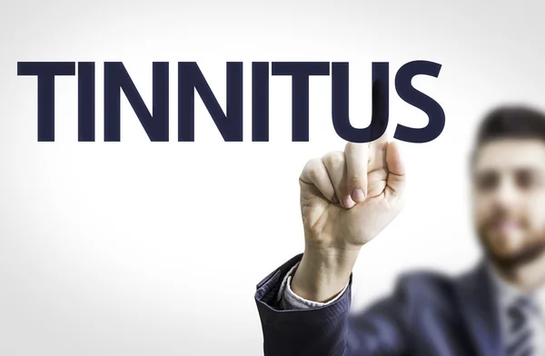 Affärsman pekar texten: Tinnitus — Stockfoto