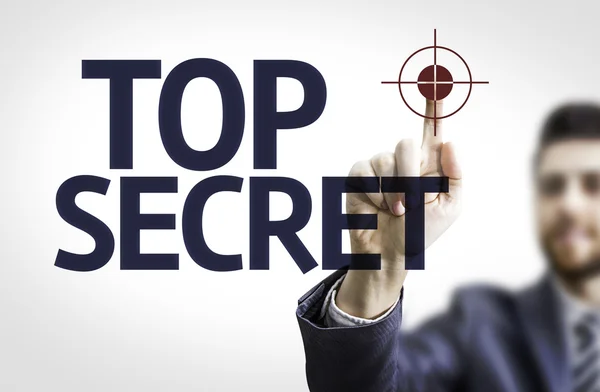 Homem de negócios apontando o texto: Top Secret — Fotografia de Stock