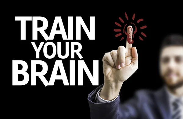 Business man pointing the text: Train your Brain — Stock Photo, Image