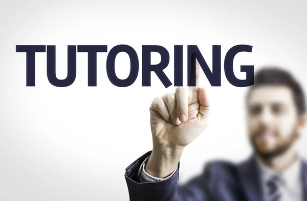 Business man pointing the text: Tutoring — Stock Photo, Image