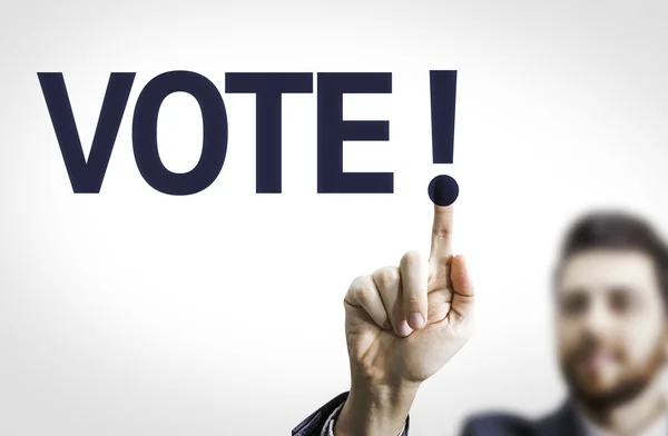 Homme d'affaires pointant le texte : Vote ! — Photo