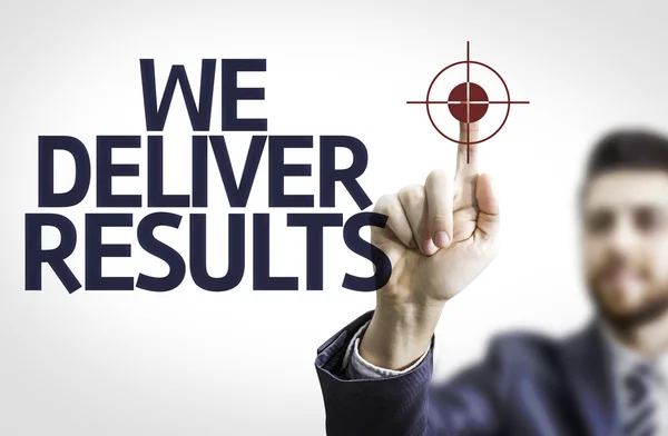 Business man pointing the text: We Deliver Results! — Stock Photo, Image