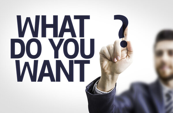 Бизнесмен указывает на текст: Чего вы хотите
?