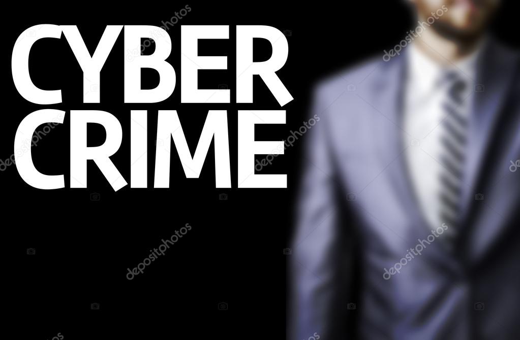 Cyber Crime written on a board with a business man