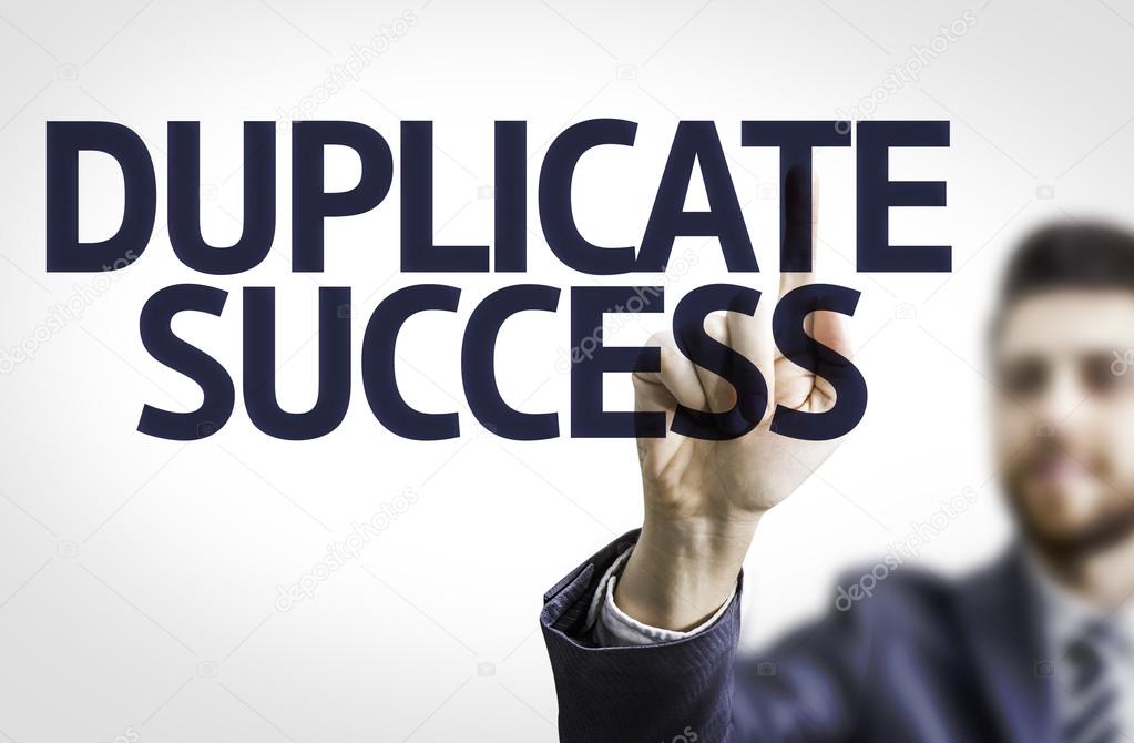 Business man pointingthe text: Duplicate Success