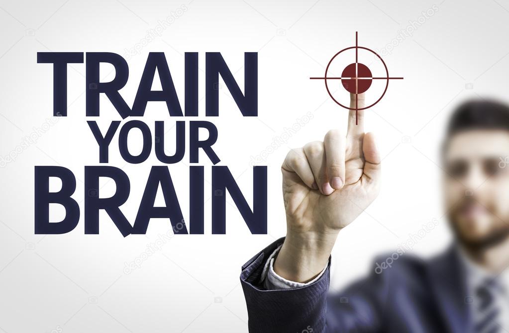 Business man pointing the text: Train your Brain