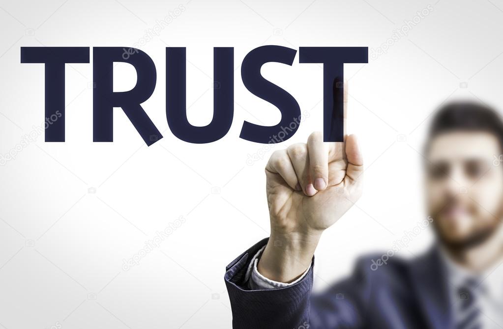 Business man pointing the text: Trust