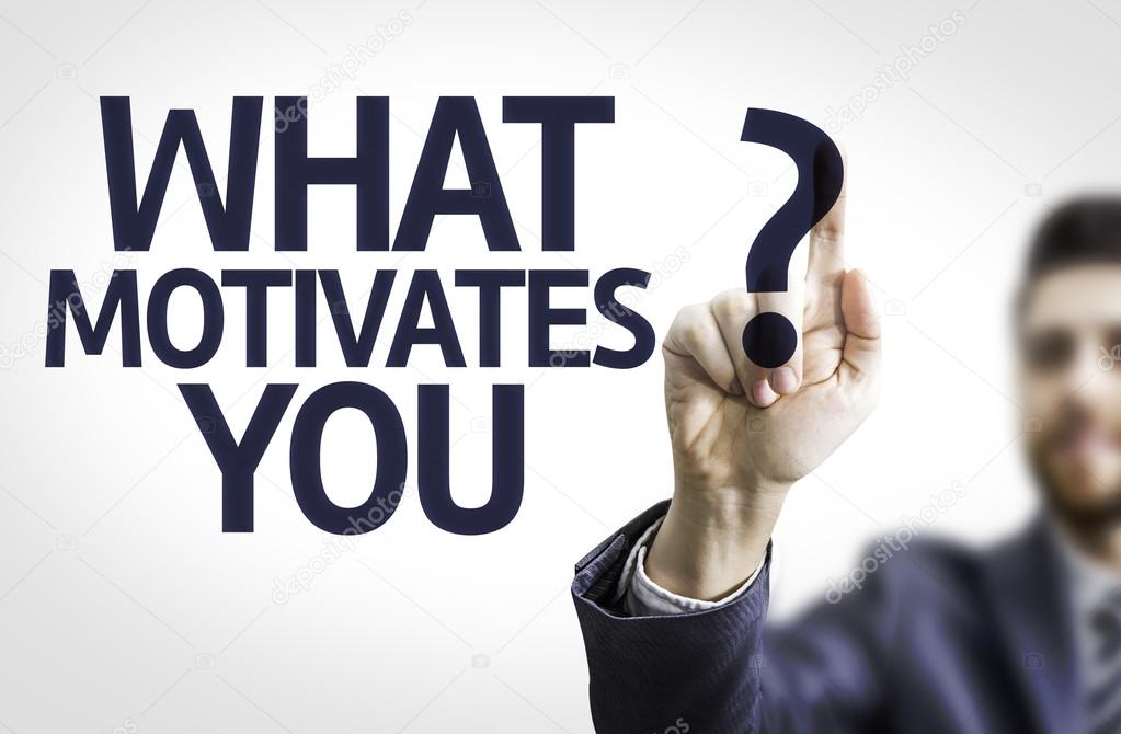 Business man pointing the text: What Motivates You?
