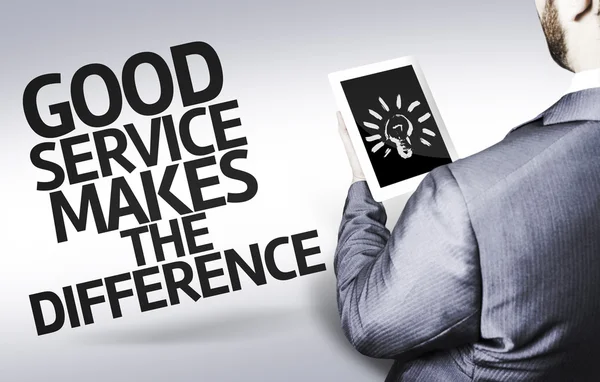 Homme d'affaires avec le texte Good Service Makes The Difference in a concept image — Photo