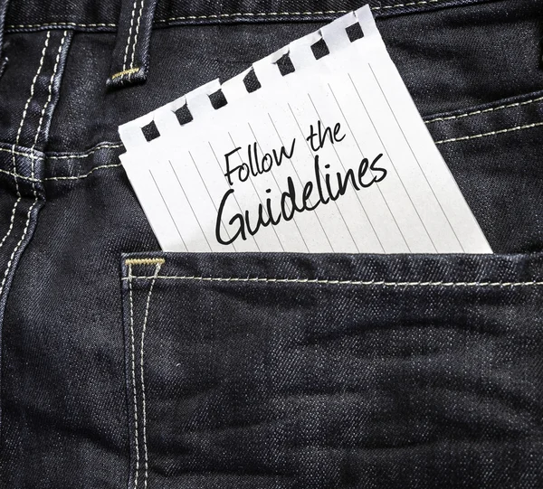 Follow the Guidelines written on a peace of paper — Stock Photo, Image