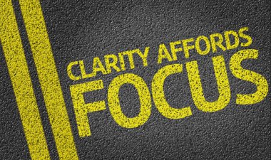Clarity Affords Focus written on road clipart