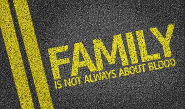 Family Is Not Always About Blood written on the road clipart